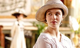 Sybil Crawley Branson of Downton Abbey wearing a summer outfit and hat.